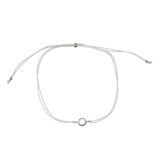 
Delicate adjustable string bracelet featuring a moonstone set in a sterling silver bezel.

