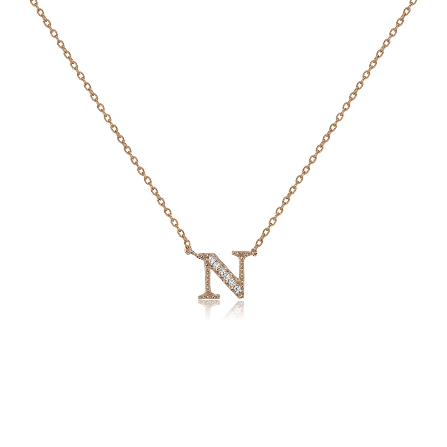 
Rose gold plated initial 'N' necklace with cubic zirconia decoration  .

