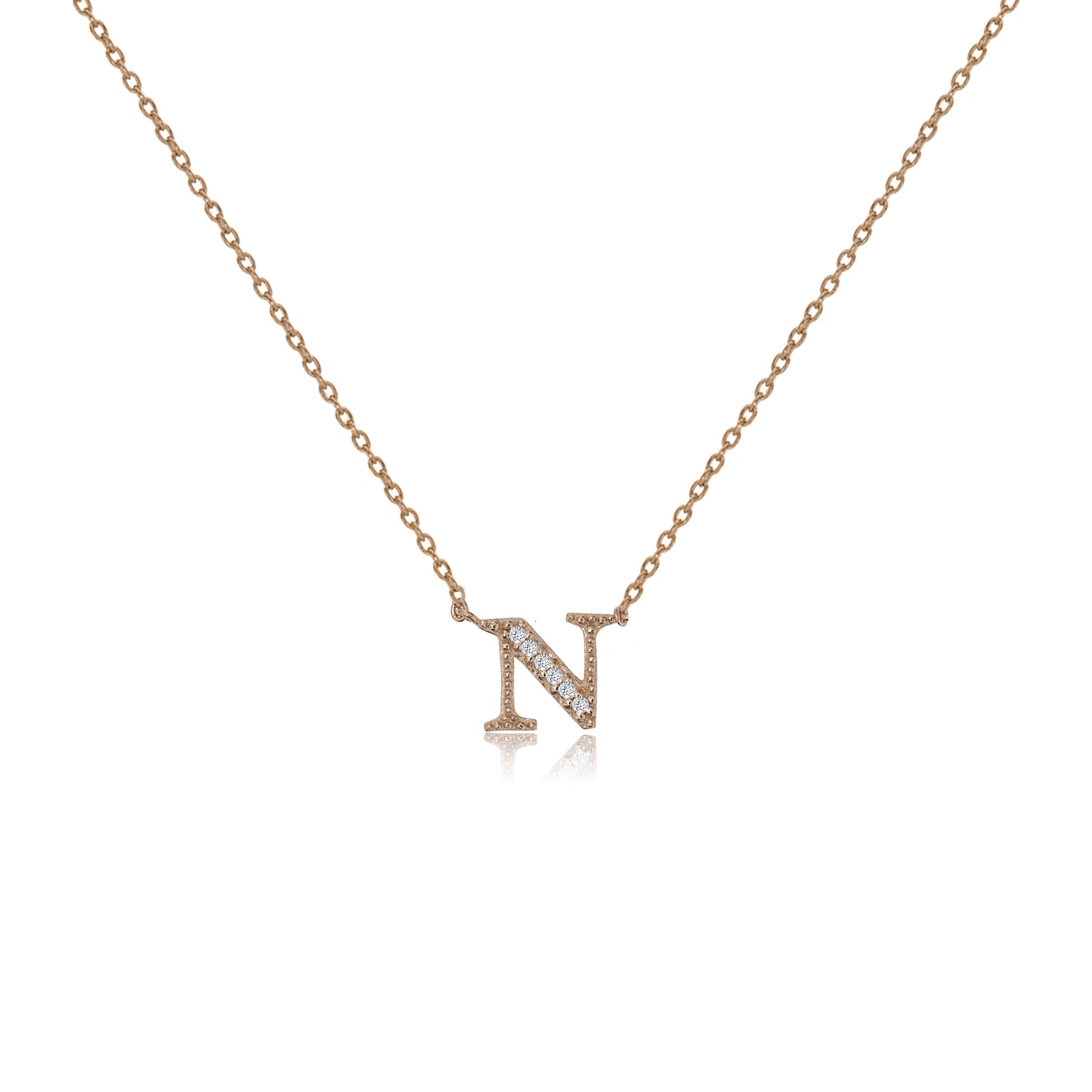 
Rose gold plated initial 'N' necklace with cubic zirconia decoration  .

