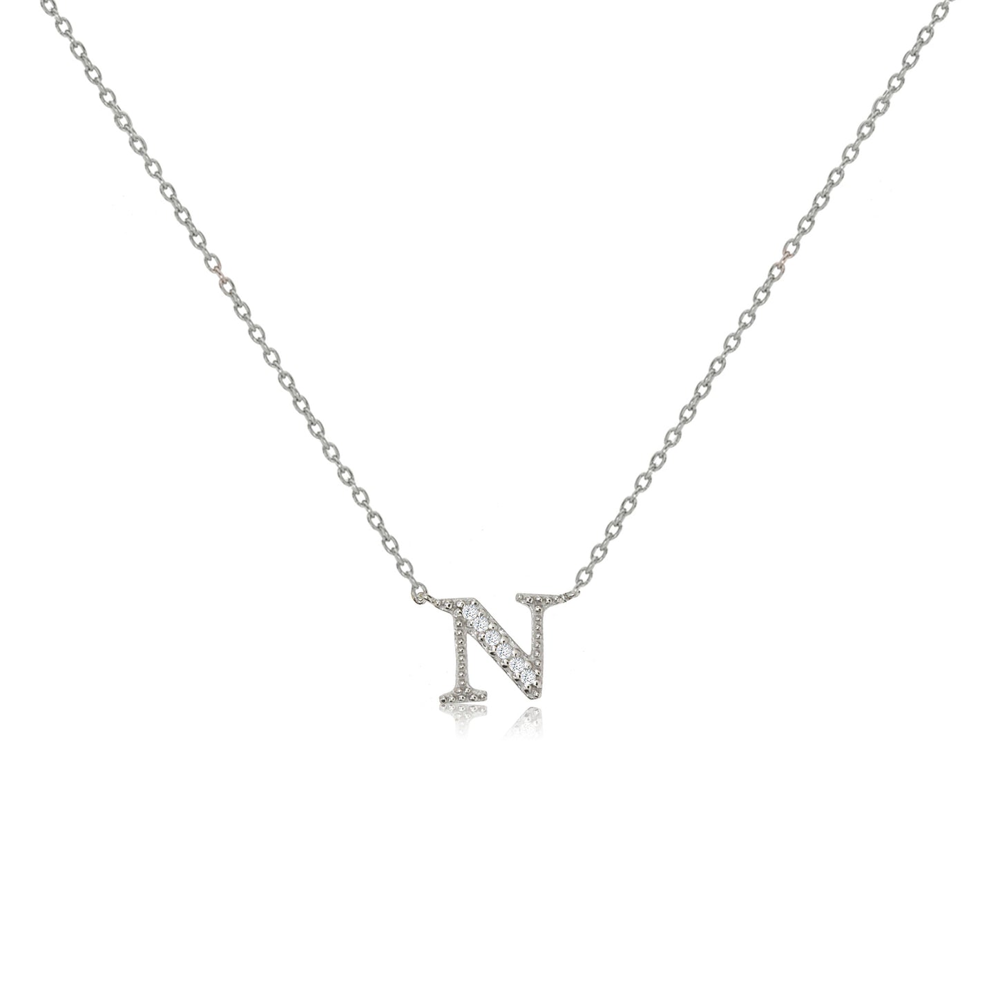 
Sterling silver initial necklace featuring an 'N' pendant decorated with cubic zirconia stones on an adjustable chain.

